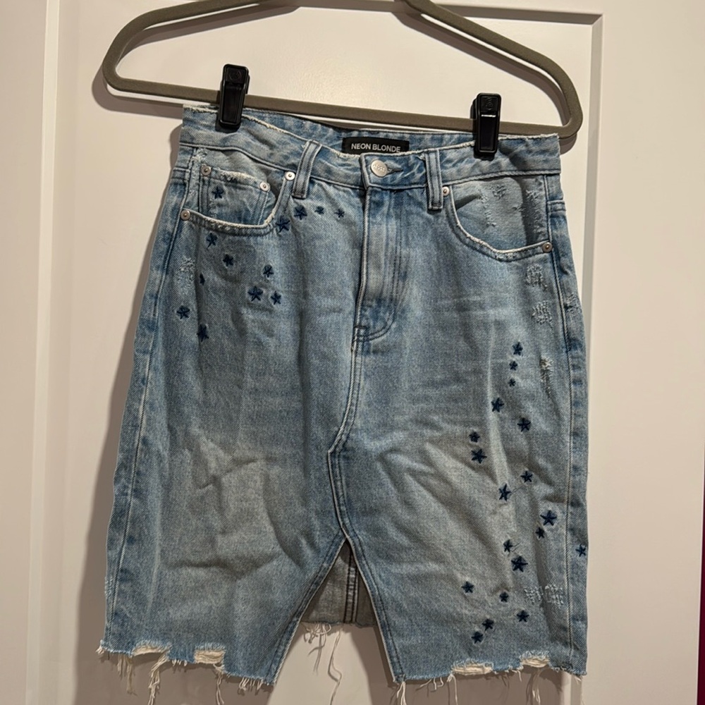 Neon Blonde distressed denim skirt with stars. Size 26.